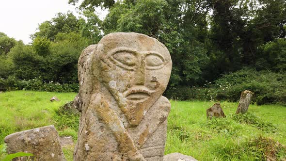 This is a Bronze Age Stone Carviing with Two Facescalled Janus Located In Caldragh Cemetery on Boa