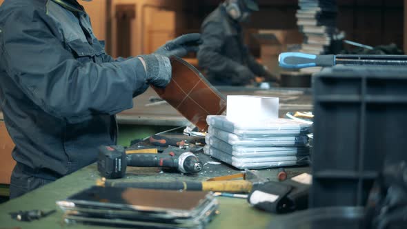 People Prepare Garbage for Recycling in a Facility.