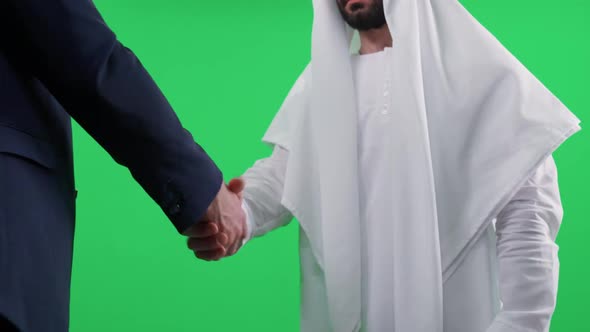 Chromakey Template Arab Man in a White Kandura Makes a Good Deal with a Partner Buisnessman in a