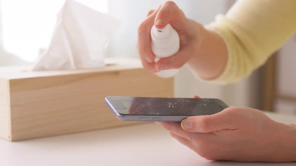 Close Up of Woman Cleaning Smartphone