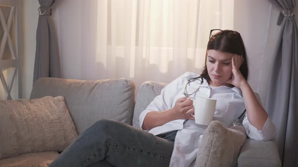 Tired Doctor Resting Nurse Woman Coffee Couch