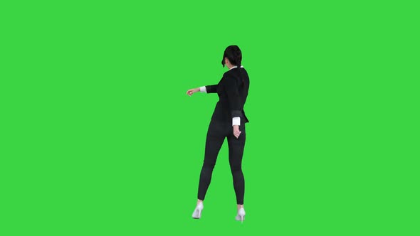 Adorable Confident Young Business Woman Dancing on a Green Screen, Chroma Key