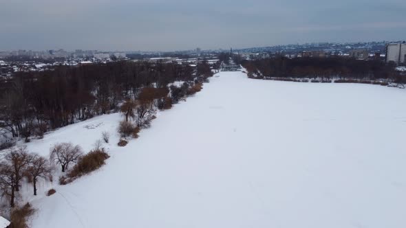 Aerial Kharkiv, frozen winter Lopan river with dam