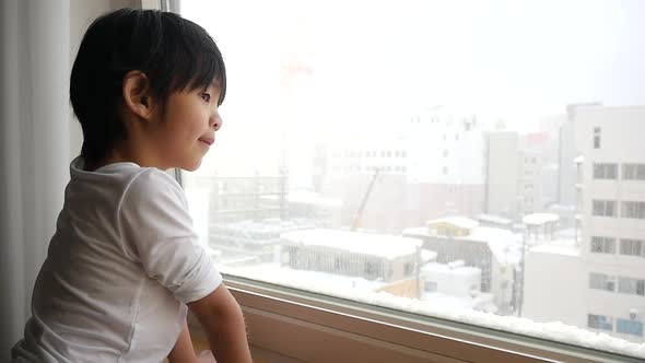 Asian Child Looking At The Window Slow Motion 