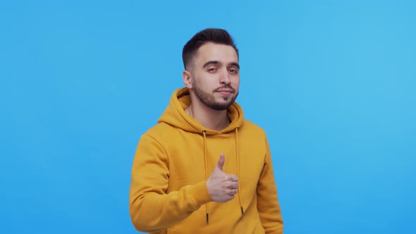 Expressive young man screaming and shouting over vibrant background.