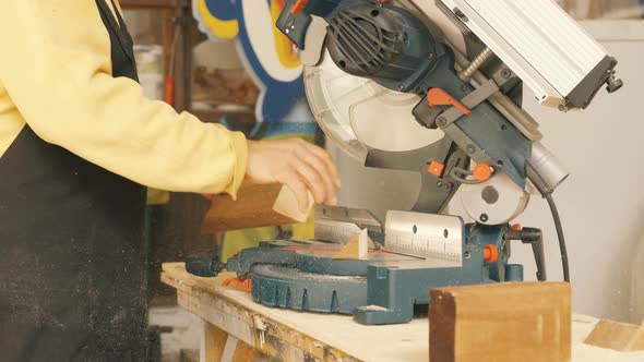 Slow Motion Close Up of Table Saw Cutting Wood on Construction Site