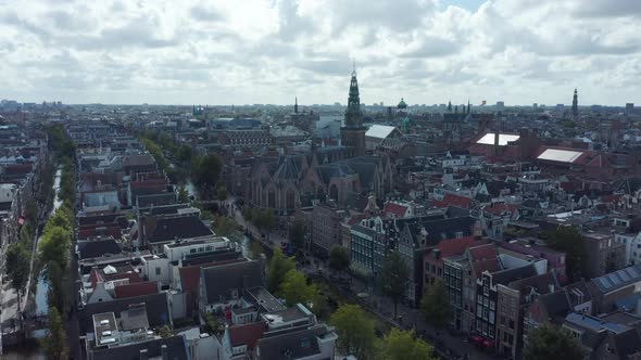 Amsterdam Cityscape with Canals From Drone Perspective with Clouds