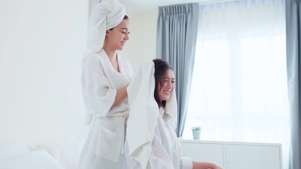 Asian beautiful lesbian couple spending morning leisure time together.