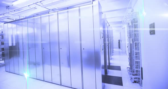 Computer servers in a server room with glowing lights alt