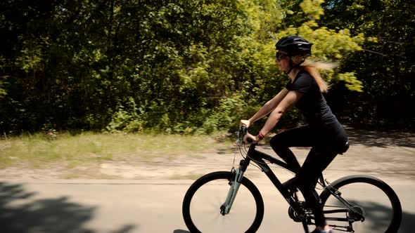 Cyclist Wearing Tights Workout.Vacation Holiday Fun Sport Recreation.Handsome Female Cycling On Bike