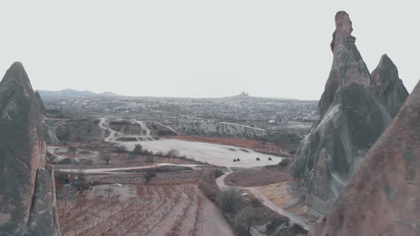 Fairy Chimneys rock formation in Cappadocia, Turkey. Aerial backward