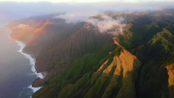 Dramatic Sunset View of Hawaiian Coastline and Pacific Ocean. Impressive Aerial Footage