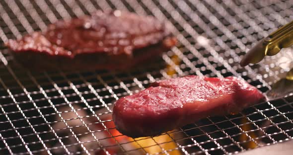 Cooking Delicious Juicy Meat Steak on The Grill