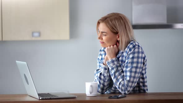 Smiling Young Domestic Woman Using Laptop Pc at Home Kitchen Enjoying Weekend Medium Closeup