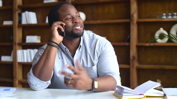 Handsome AfricanAmerican Salesman on the Phone