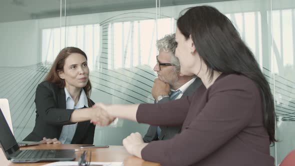 Employers and Job Candidate Shaking Hands