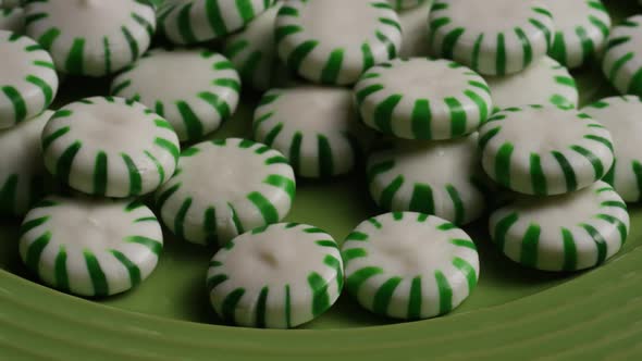 Rotating shot of spearmint hard candies - CANDY SPEARMINT 048