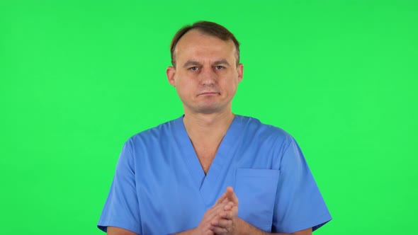 Medical Man Claps His Hands with Dissatisfaction. Green Screen