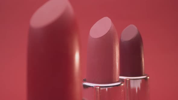 Lipsticks against Red Background