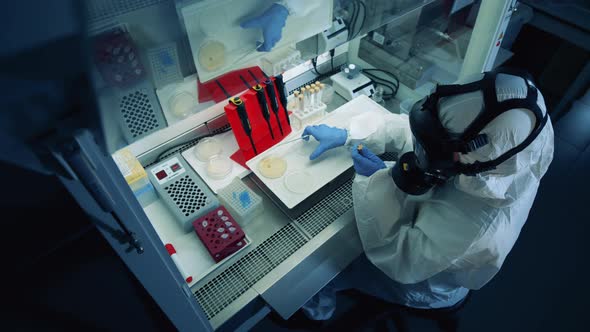 Biologist Works with Samples, Developing a Vaccine Against Coronavirus.