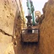 In the Trench, the Excavator Lifts the Earth - VideoHive Item for Sale