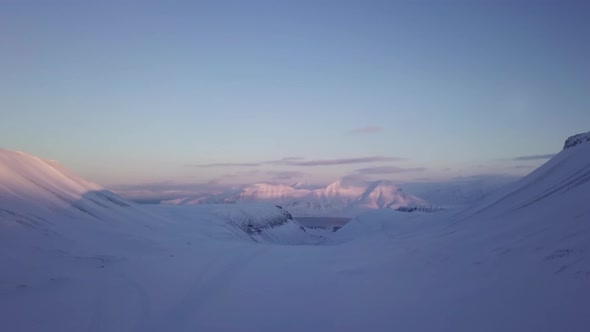 Drone Flight Near Longyearbyen Snowy Mountains on Svalbard