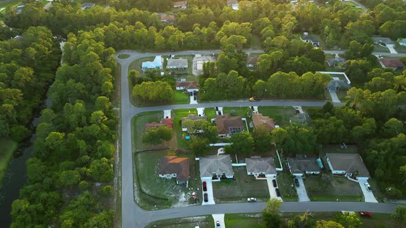 Aerial View of Suburban Landscape with Private Homes Between Green Palm Trees in Florida Quiet