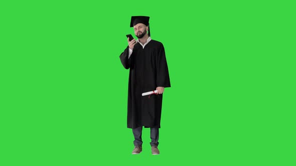 Mature Man Graduate Student Recording Voice Message on a Green Screen, Chroma Key.