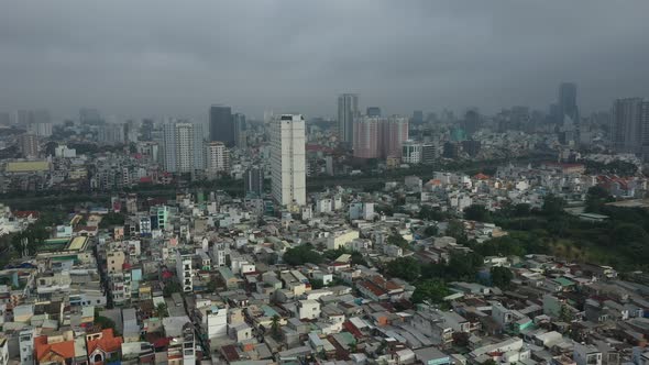 Saigon, Ho Chi Minh City, Vietnam early morning drone footage flying in over district four with view