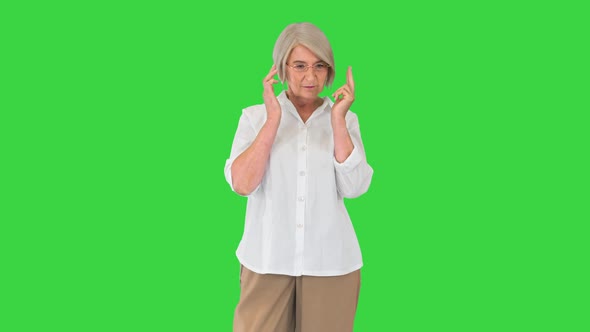 Charming Senior Woman Lady Talking To Someone on a Green Screen Chroma Key