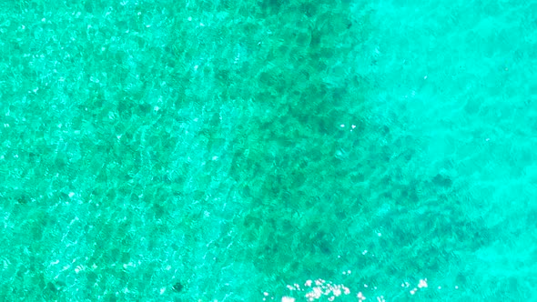 Sea Surface in a Turquoise Lagoon, Top View. Transparent Turquoise Sea Water, Natural Background