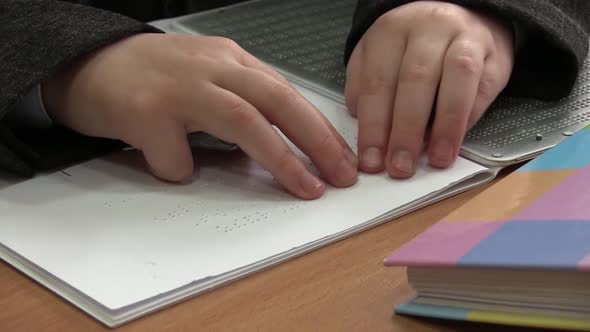 Kid Reading Braille