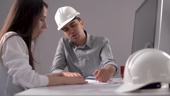 Engineers working and shaking hands.