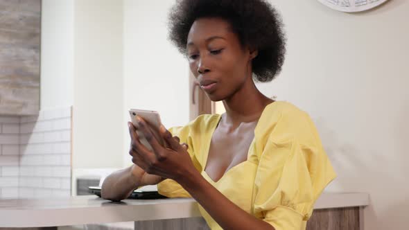 Beautiful African American Woman Uses Mobile Phone Internet Communication with Friends Online Social