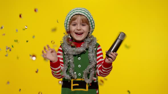 Kid Child Teenager Girl Christmas Elf Santa Helper Costume Having Fun Rejoices Over Confetti Rain