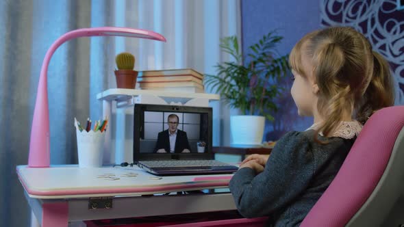 Girl Pupil Doing School Homework with Man Teacher Using Laptop Computer at Home Distance Education