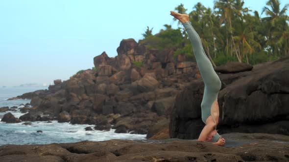 Yoga Teacher Gets Out of Sirsasana on Sea Coast Slow Motion