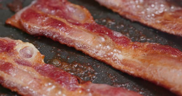 Fry bacon on pan