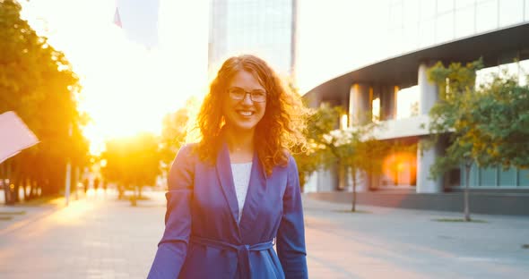 Happy woman finished the project, throwing papers, freedom after work, success in business.