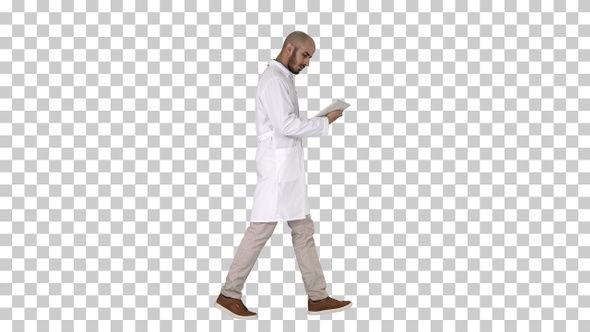 Doctor checking his tablet walking, Alpha Channel