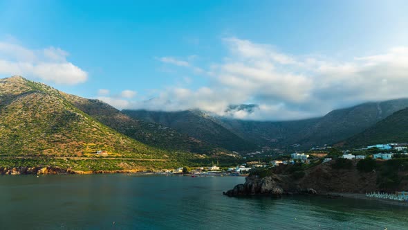 Time Lapse of Clouds moving above Bay and Mountains in Bali, Crete, Greece. 