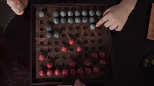 Board Game with Red and Blue Balls on the Playing Field