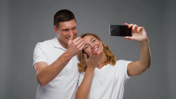 Happy Couple Taking Selfie By Smartphone