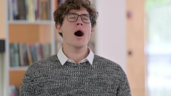 Portrait of Sick Young Man Sneezing 