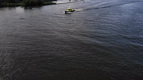 Dutch law enforcement sailing on a dutch river