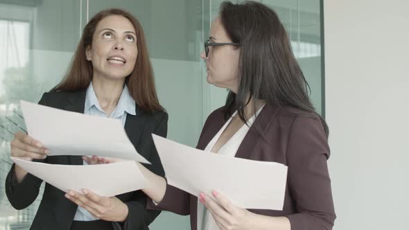 Two Female Business Colleagues Standing Together