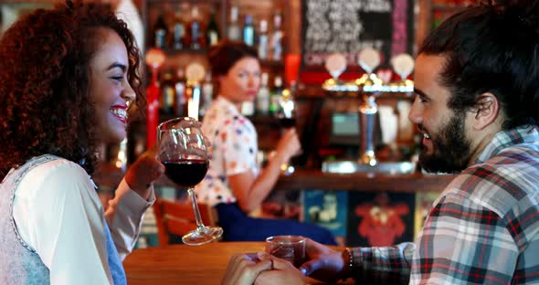 Jealous woman looking at couple flirting with each other