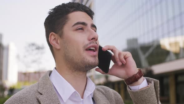  Attractive Businessman Talking on Mobile Phone