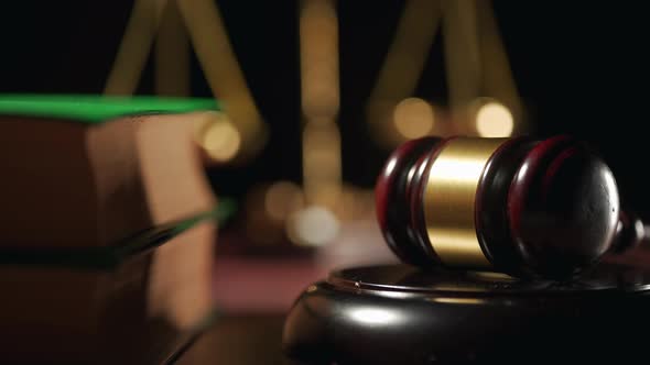 Close Up of a Judge Gavel and a Scales of Justice