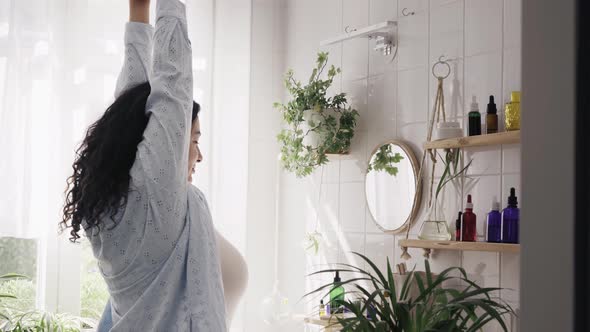 Young Overweight Woman Stretching in Bathroom